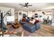 Open-concept living room with modern decor and a view into the kitchen and dining area at 165 Lavenna Ave, St Cloud, FL 34771