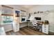 Well-lit office space with dual monitors, shelves for collectibles, and natural light from two windows at 165 Lavenna Ave, St Cloud, FL 34771