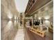 Modern home bar with wine racks, custom shelves, and marble floor at 17551 Black Rail St, Windermere, FL 34786