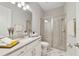 Stylish bathroom with marble tile flooring and a walk-in shower with glass doors at 17551 Black Rail St, Windermere, FL 34786