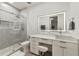 Contemporary bathroom with sleek vanity, vessel sink, and walk-in shower featuring elegant tile and glass at 17551 Black Rail St, Windermere, FL 34786