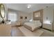 A stylish bedroom with modern lights, neutral paint, and minimalist design creates a relaxing retreat at 17551 Black Rail St, Windermere, FL 34786