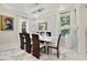 Dining room with marble floors, chandelier, and a view to the kitchen at 17551 Black Rail St, Windermere, FL 34786