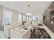 Bright, expansive living room with marble floors, stylish decor, a mirrored wall, and ample seating at 17551 Black Rail St, Windermere, FL 34786