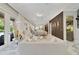 Bright open floorplan view from the living room showing marble floors, elegant decor, and lots of natural light at 17551 Black Rail St, Windermere, FL 34786