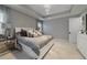 Bedroom featuring neutral decor, carpet, many pillows, and large windows with light-filtering curtains at 17551 Black Rail St, Windermere, FL 34786