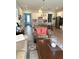 Inviting open-concept living space featuring wood floors and a seamless flow to the kitchen at 2042 Key Bay Trl, Kissimmee, FL 34747