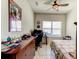 Bedroom featuring a wooden dresser and a window that provides natural light into the room at 2149 Tudor Rose Dr, Sanford, FL 32773