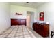 Cozy bedroom with a wooden bed frame and a dresser with collegiate decor at 2149 Tudor Rose Dr, Sanford, FL 32773