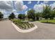 Well-maintained community entrance with manicured landscaping and a decorative sign at 2149 Tudor Rose Dr, Sanford, FL 32773