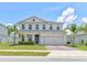 Charming two-story home with well-manicured lawn, lush landscaping, and a two car garage at 2149 Tudor Rose Dr, Sanford, FL 32773