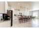 Spacious kitchen featuring a center island with barstool seating and modern appliances at 2149 Tudor Rose Dr, Sanford, FL 32773