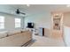 Cozy living room area with ceiling fan and mini fridge; ideal for entertaining or relaxation at 2149 Tudor Rose Dr, Sanford, FL 32773