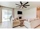 Inviting living room with a decorative fireplace, neutral furnishings, and sliding glass doors to let in natural light at 2149 Tudor Rose Dr, Sanford, FL 32773