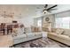 Spacious open concept living room, blending kitchen, dining, and living spaces, with neutral tones at 2149 Tudor Rose Dr, Sanford, FL 32773