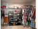 This walk-in closet offers ample storage space with shelves and hanging racks for clothes and accessories at 2149 Tudor Rose Dr, Sanford, FL 32773