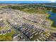 High-angle aerial view of a large, modern residential neighborhood with ponds and green spaces at 2563 Relaxing Ln, Kissimmee, FL 34744