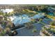 Community clubhouse with pool, tennis courts, and lush landscaping in a desirable neighborhood at 2563 Relaxing Ln, Kissimmee, FL 34744