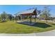 Community picnic pavilion on well-maintained grounds with lush grass and a playground nearby at 2563 Relaxing Ln, Kissimmee, FL 34744