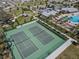 Aerial view of the community tennis courts, pavilion, pool and playground area at 2563 Relaxing Ln, Kissimmee, FL 34744