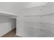Spacious walk-in closet with white wire shelving offering ample storage space at 2563 Relaxing Ln, Kissimmee, FL 34744