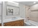 Bathroom featuring modern vanity with quartz countertop, tiled shower, and contemporary fixtures at 264 Agnes Ave, Longwood, FL 32750