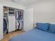 Bedroom with a closet featuring custom shelving, drawers and ample hanging space at 264 Agnes Ave, Longwood, FL 32750