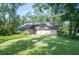 Well maintained home with a plush green lawn and mature landscaping at 264 Agnes Ave, Longwood, FL 32750