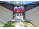 Inviting front entrance with double doors, brick pathway, and a stylish red awning at 264 Agnes Ave, Longwood, FL 32750