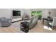 Bright living room with modern furniture, sleek entertainment center, and sliding glass doors to outside at 264 Agnes Ave, Longwood, FL 32750