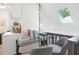 Cozy loft area with glass-top desk, comfortable seating, and ample natural light from a skylight at 264 Agnes Ave, Longwood, FL 32750