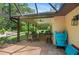 A spacious screened patio with ample seating and a grill at 264 Agnes Ave, Longwood, FL 32750