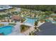 Stunning aerial view of community pool and lazy river, perfect for relaxation and Gathering fun at 2665 Petition Ln, Kissimmee, FL 34746