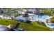 Expansive aerial view showcasing the community pool, clubhouse, miniature golf, and surrounding landscape at 2665 Petition Ln, Kissimmee, FL 34746