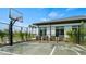 Outdoor basketball court with a modern hoop and fencing, surrounded by trees and greenery at 2665 Petition Ln, Kissimmee, FL 34746