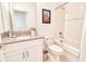 Bright bathroom with shower over tub and vanity with stainless steel plumbing fixtures at 2665 Petition Ln, Kissimmee, FL 34746