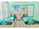 Unique bedroom featuring twin beds, playful cartoon decor and vibrant lighting at 2665 Petition Ln, Kissimmee, FL 34746