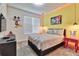 A bedroom featuring Mickey Mouse accents, pendant lighting, and a fun, playful design at 2665 Petition Ln, Kissimmee, FL 34746