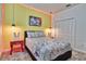 A bedroom featuring Mickey Mouse accents, pendant lights, and a double-door closet at 2665 Petition Ln, Kissimmee, FL 34746