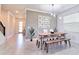 Cozy dining area adjacent to entryway, featuring modern lighting and stylish decor at 2665 Petition Ln, Kissimmee, FL 34746