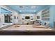 Bright game room featuring a billiard table, seating, and wall art, complemented by stylish decor and natural light at 2665 Petition Ln, Kissimmee, FL 34746
