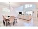 Bright, open-concept living room with tall ceilings, tile floors and plenty of natural light at 2665 Petition Ln, Kissimmee, FL 34746