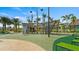 Fun pirate-themed playground with slides, climbing features, and ship elements, nestled among palm trees and lush landscaping at 2665 Petition Ln, Kissimmee, FL 34746