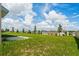 Expansive backyard featuring a lush lawn and neighborhood views at 2817 Muller Oak Loop, Ocoee, FL 34761