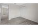 Bedroom featuring carpeting and a closet and an open doorway for a calm, comfortable atmosphere at 2817 Muller Oak Loop, Ocoee, FL 34761