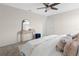 Neutral bedroom with a ceiling fan, decor, and a small vanity area by the entrance to the room at 2817 Muller Oak Loop, Ocoee, FL 34761