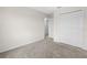 Bedroom with plush carpeting and a double closet, leading to the open doorway at 2817 Muller Oak Loop, Ocoee, FL 34761