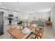 Open concept kitchen with gray counters and white cabinets that flows into a cozy living area at 2817 Muller Oak Loop, Ocoee, FL 34761
