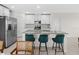 Kitchen with gray counters, sleek stainless steel appliances, and a breakfast bar with comfortable seating at 2817 Muller Oak Loop, Ocoee, FL 34761