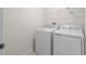 Laundry room equipped with a washer, dryer, and shelving at 2817 Muller Oak Loop, Ocoee, FL 34761